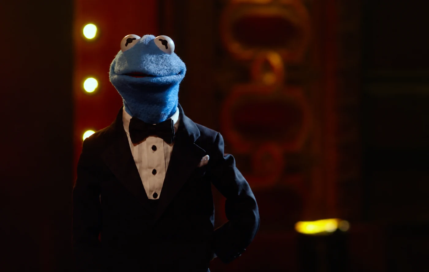 A fan-made imagining of Carlos in a black tuxedo and a cinematic lounge
